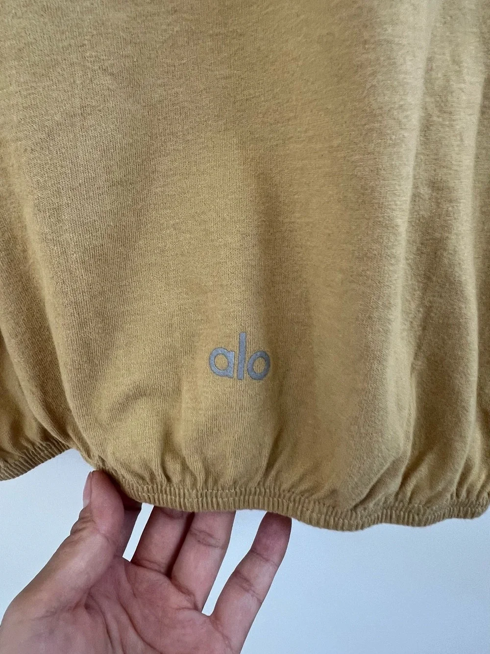 ALO Yoga Cropped Mock Neck Top in Camel Brown